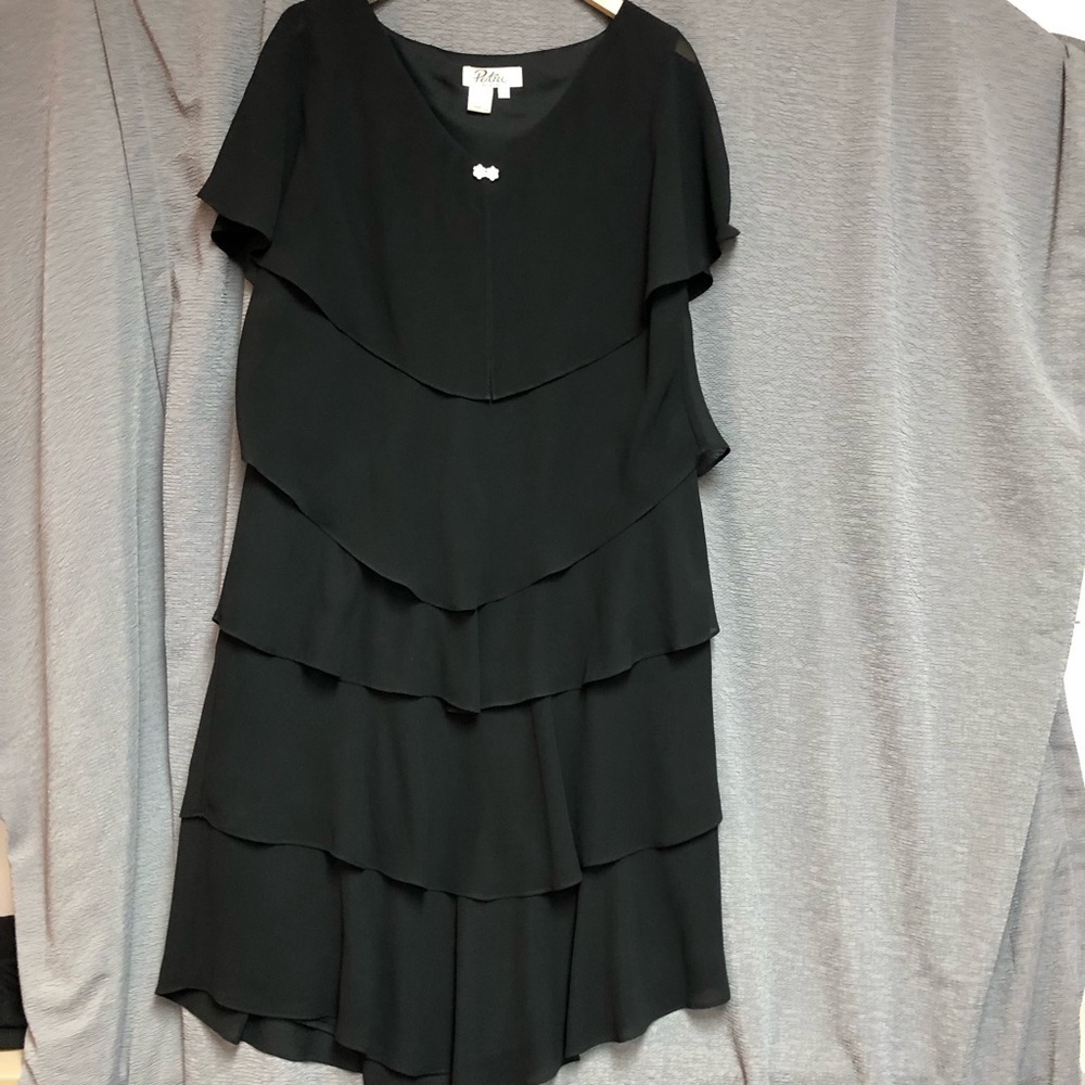 Patra woman 18 W Black sheer chiffon layers on a black sheath dress. Small bow